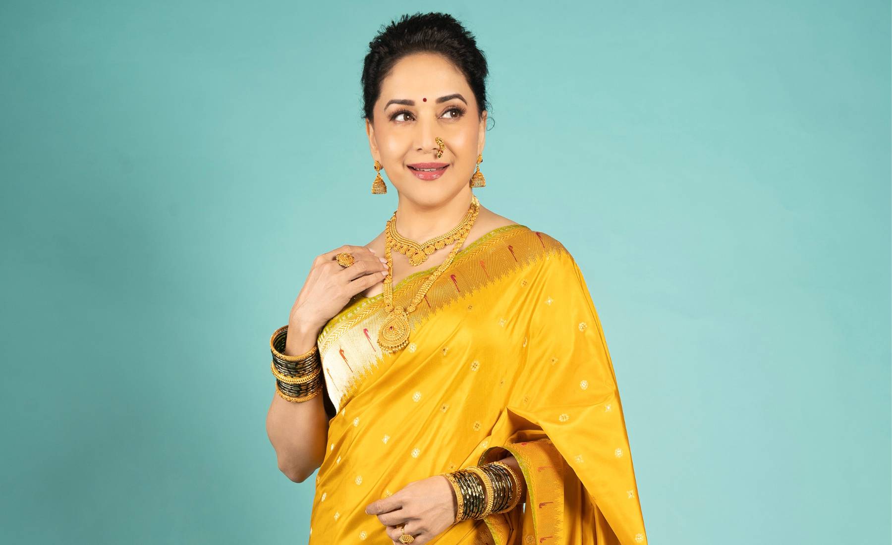 Madhuri celebrates Makar Sankranti with panache in a traditional Sacred Weaves Paithani Banarasi